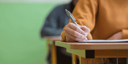 student using a pen