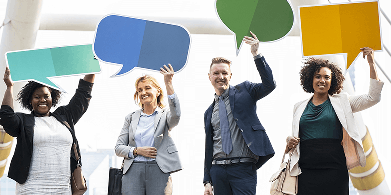 4 people holding up signs shaped as communication symbols.