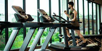 guy on treadmill in gym